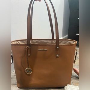 I got this at the Michael Kors store.Used a handful of times